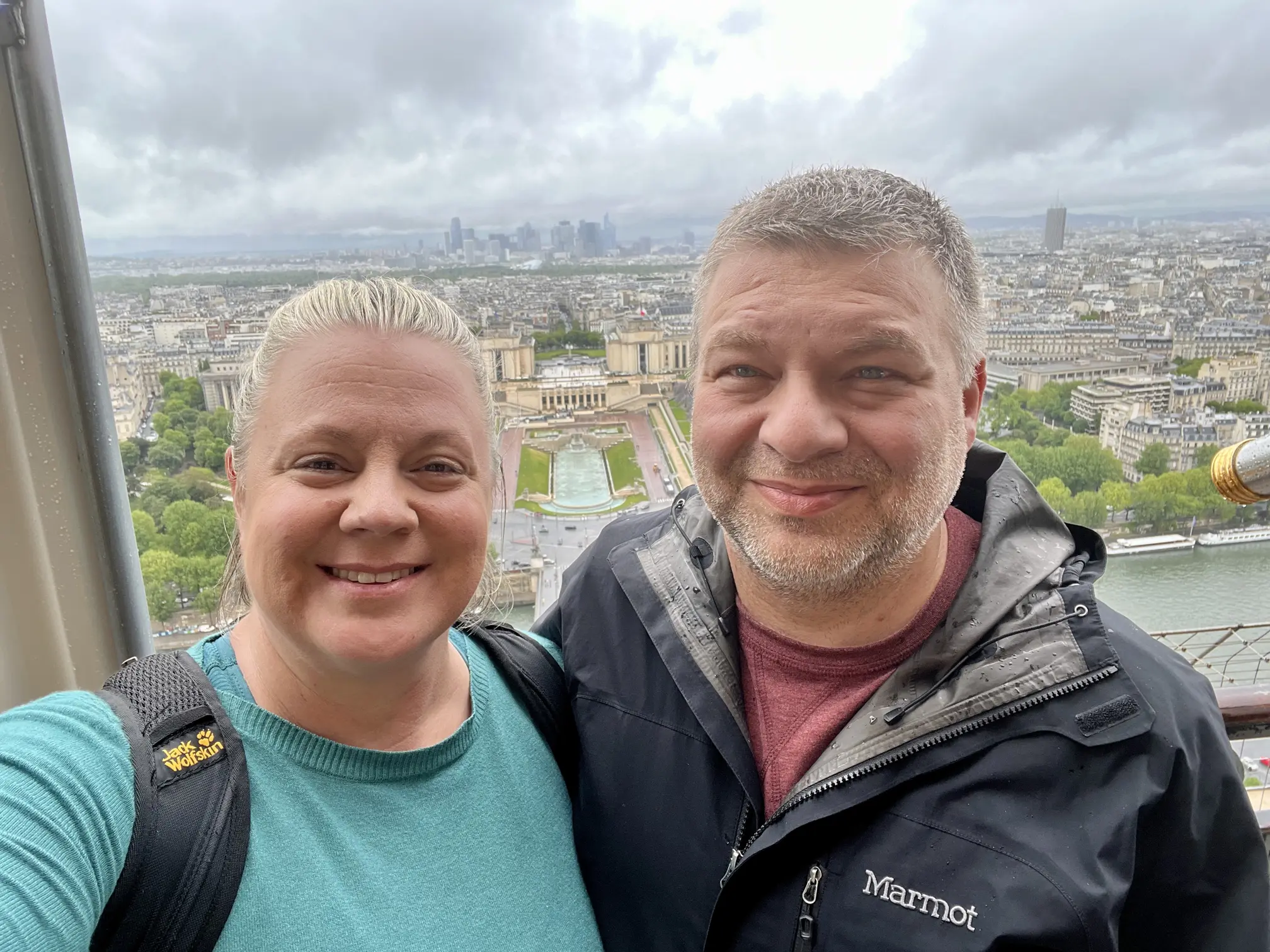 Erika and her husband Chris take a selfie from the top of the Eiffel Tower, with Paris spread out below
