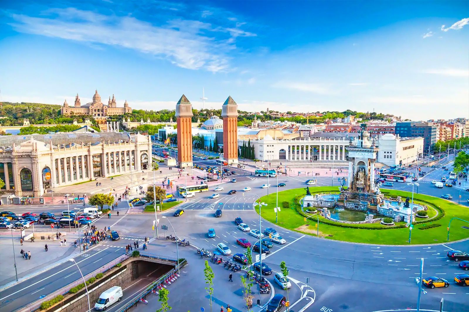 The fountain at Plaça d'Espanya in Barcelona with the Venetian Towers and Montjuïc beyond