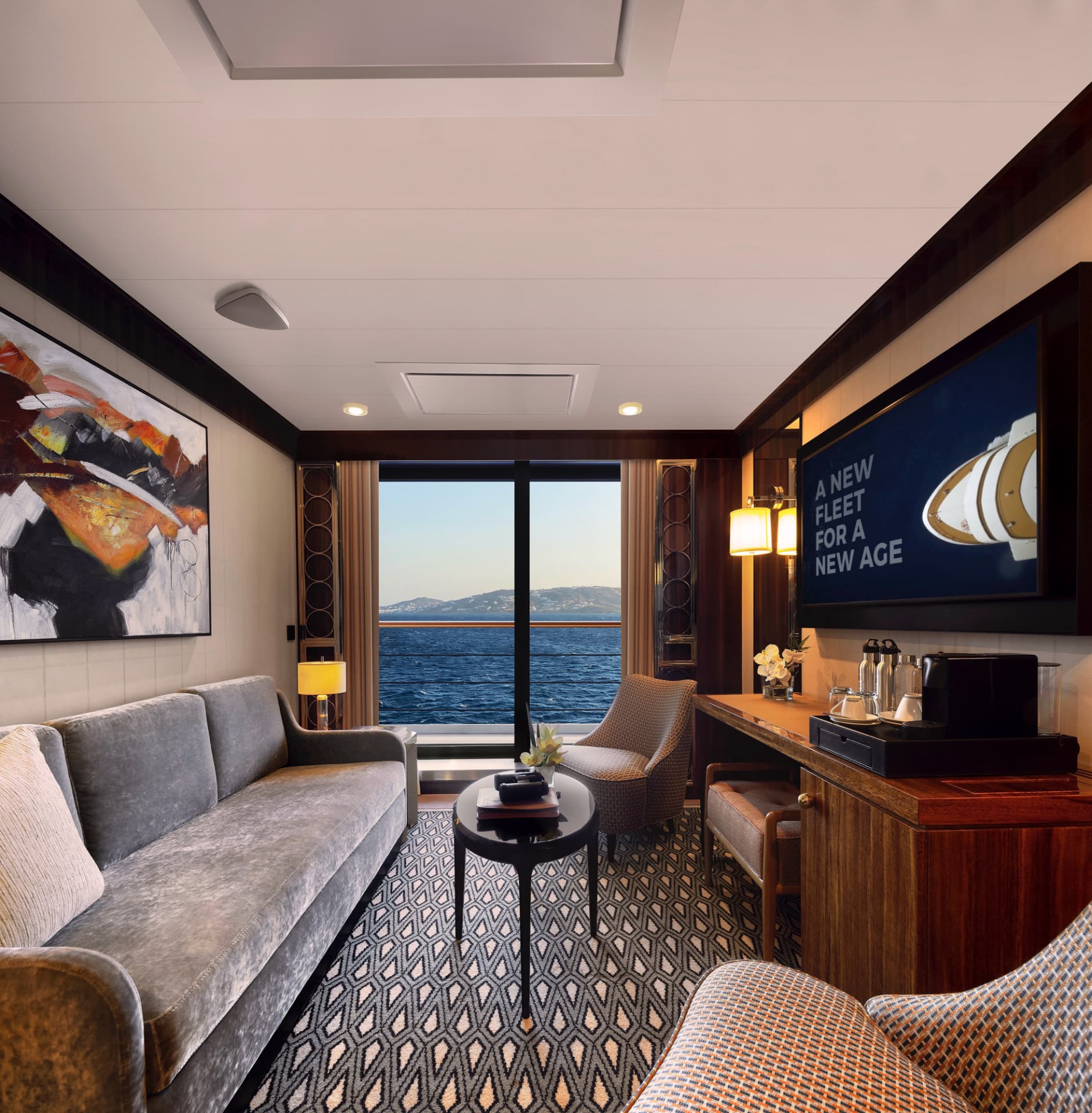 A Journey Suite with a sofa, coffee station and sliding door to a private veranda
