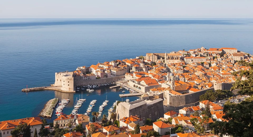Dubrovnik's walled old town and orange rooftops above the blue Adriatic Sea