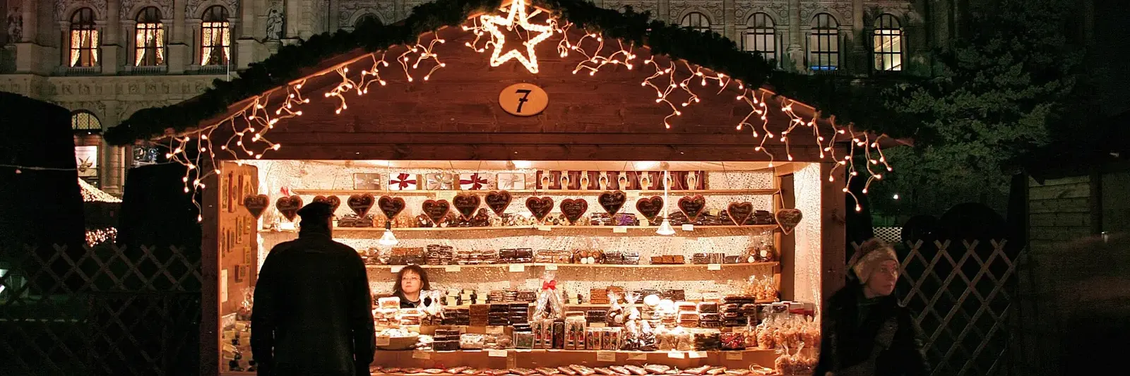 A Vienna Christmas market stall glowing at night