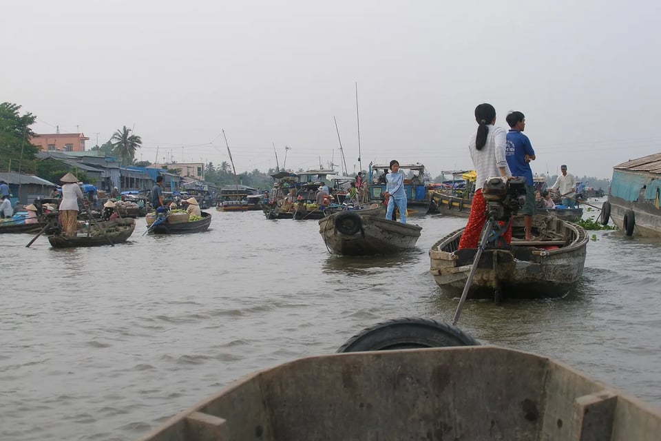 Wooden boats crowding the Cai Rang floating market on the Mekong Delta near Can Tho, Vietnam