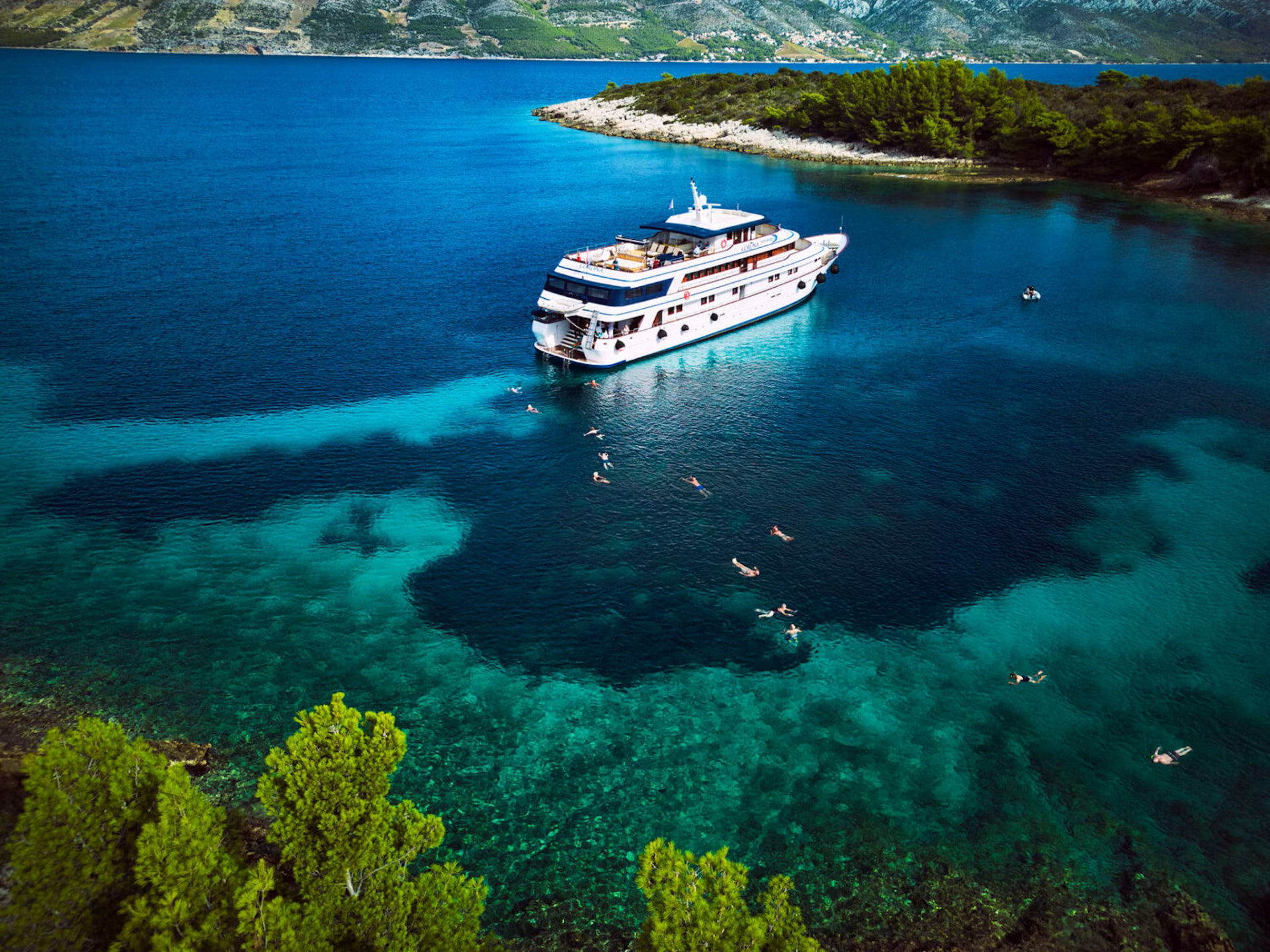 The four-star MV Felicita yacht at anchor in a Croatian bay